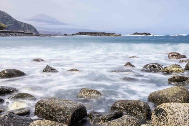 Long exposure shot of the ocean with el Teide volcano in the background